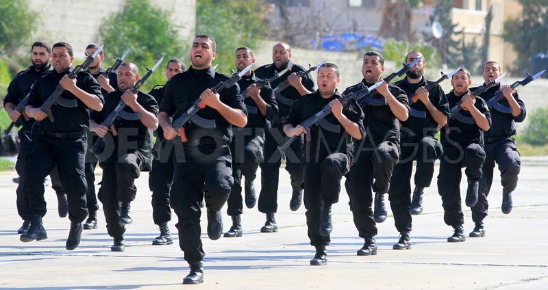 Hamas police officers demonstrate their skills during a ceremony 
