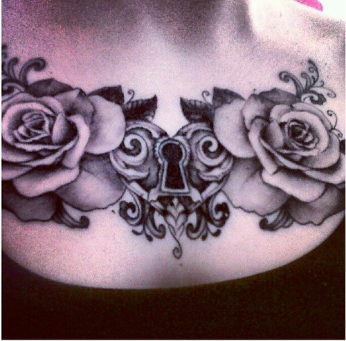 heart lock and roses upper chest tattoo. leave black and white or 