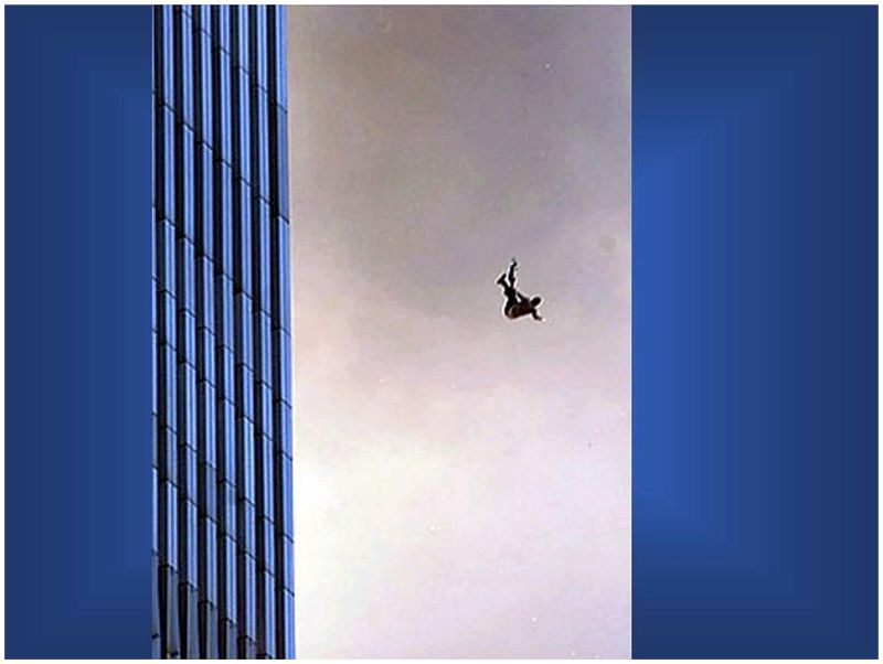 Two people holding hands as they fall from the Twin Towers on 9/11 