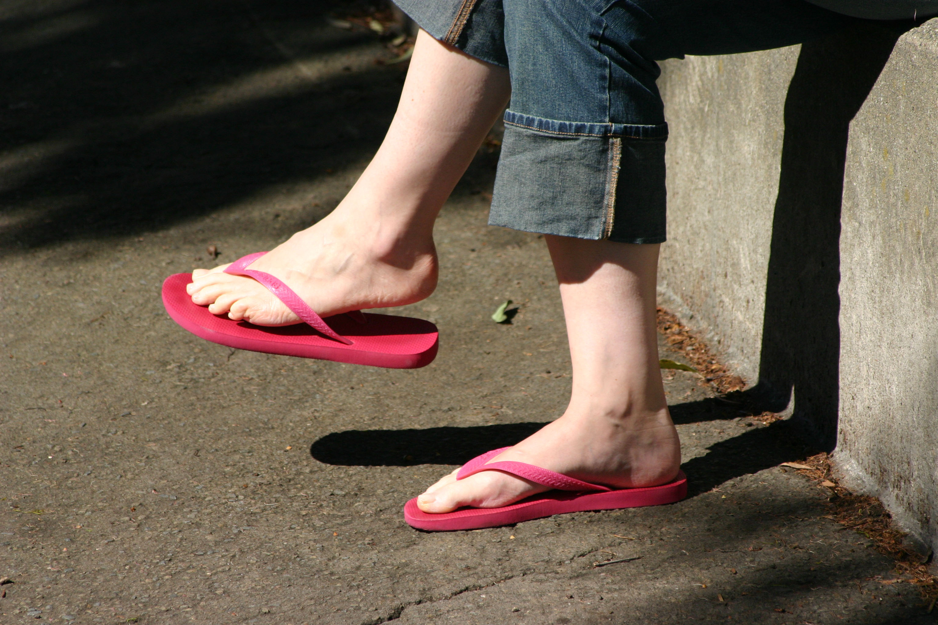Woman wearing red flip flops