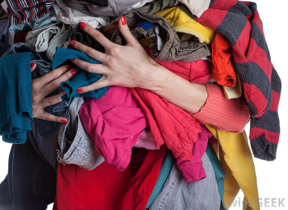 woman-holding-pile-of-clothes.jpg