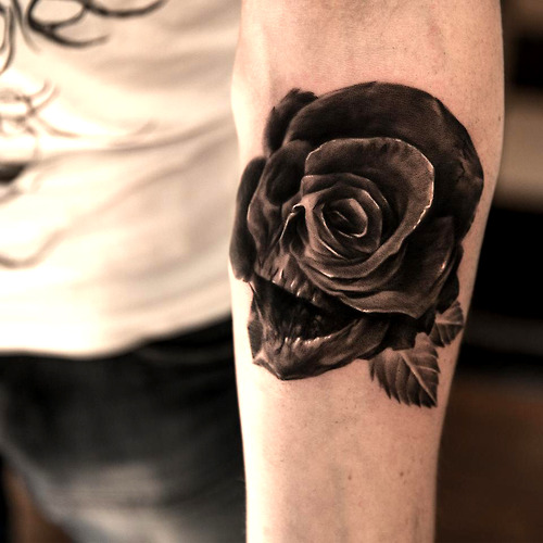Tattoo done by Niki Norberg. Black and white skull and rose 