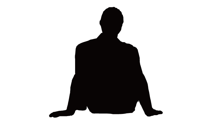 silhouette of a man sitting

