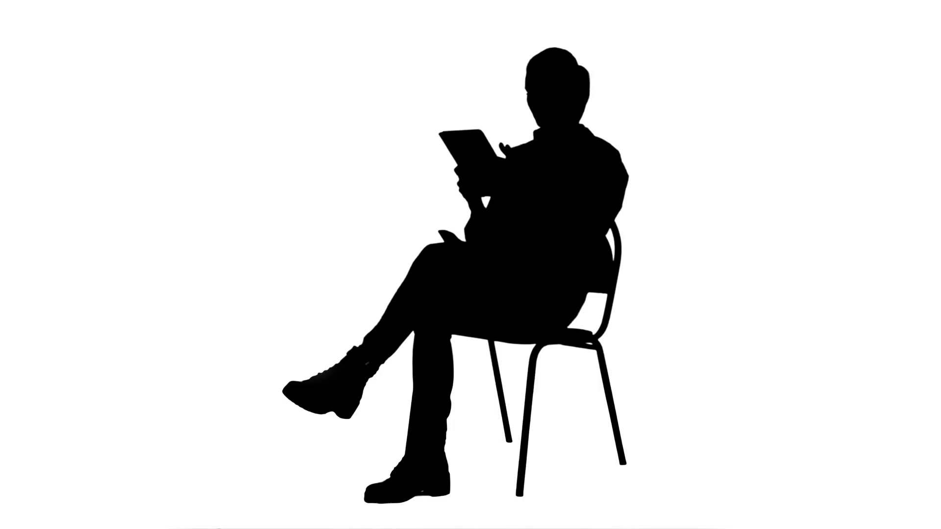 silhouette person sitting in chair
