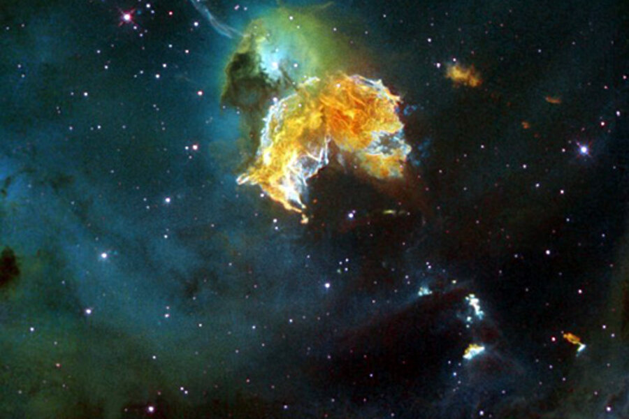 A vibrant cosmic nebula with fiery orange and green gas clouds against a star-filled deep-space backdrop.