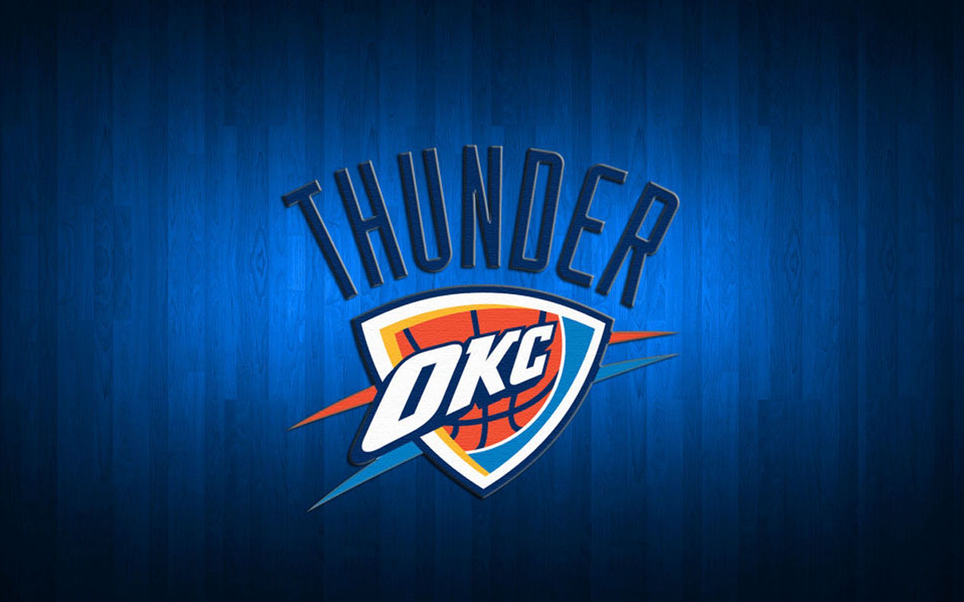 Oklahoma City Thunder logo on blue wooden background with "THUNDER" arched above shield emblem.