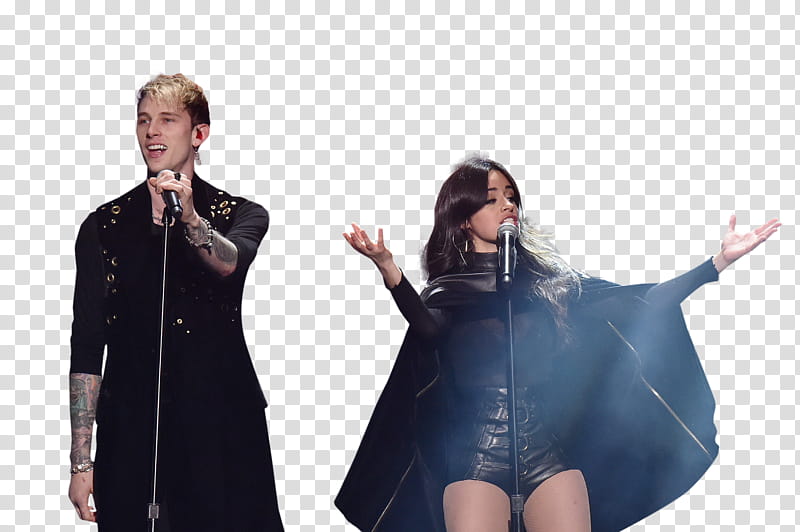 Male and female singers performing on stage with microphones, dramatic lighting, and black outfits.