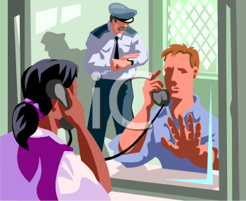 A police officer observes a man being interviewed through a glass partition while a woman speaks on the phone nearby.
