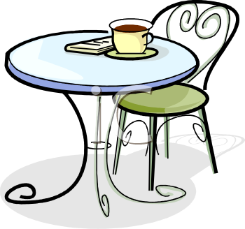 A stylish round café table with a cup of coffee, a book, and an ornate metal chair with a green cushion.