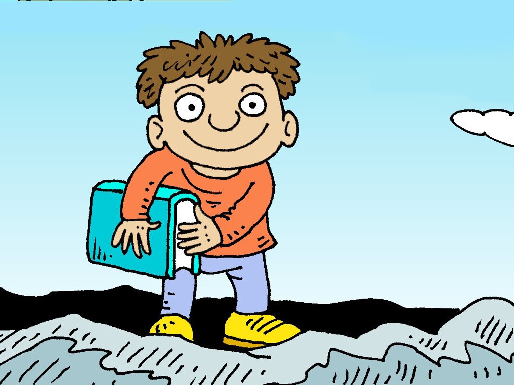A smiling boy with brown hair holds a blue book while standing on rocky terrain under a clear sky.