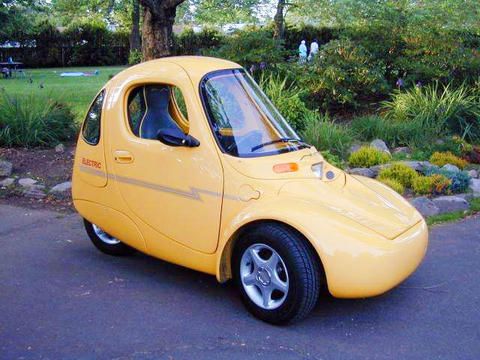 Vintage Yellow Electric Microcar - Eco-Friendly Urban Mobility Icon