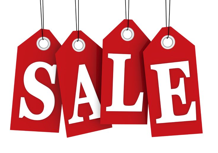 Four red hanging sale tags spelling "SALE" in bold white letters.