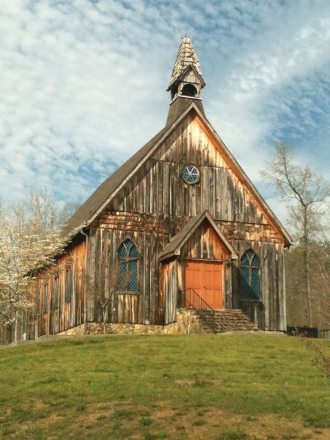 Historic Wooden Church in Rural Landscape - Architectural Heritage Photo