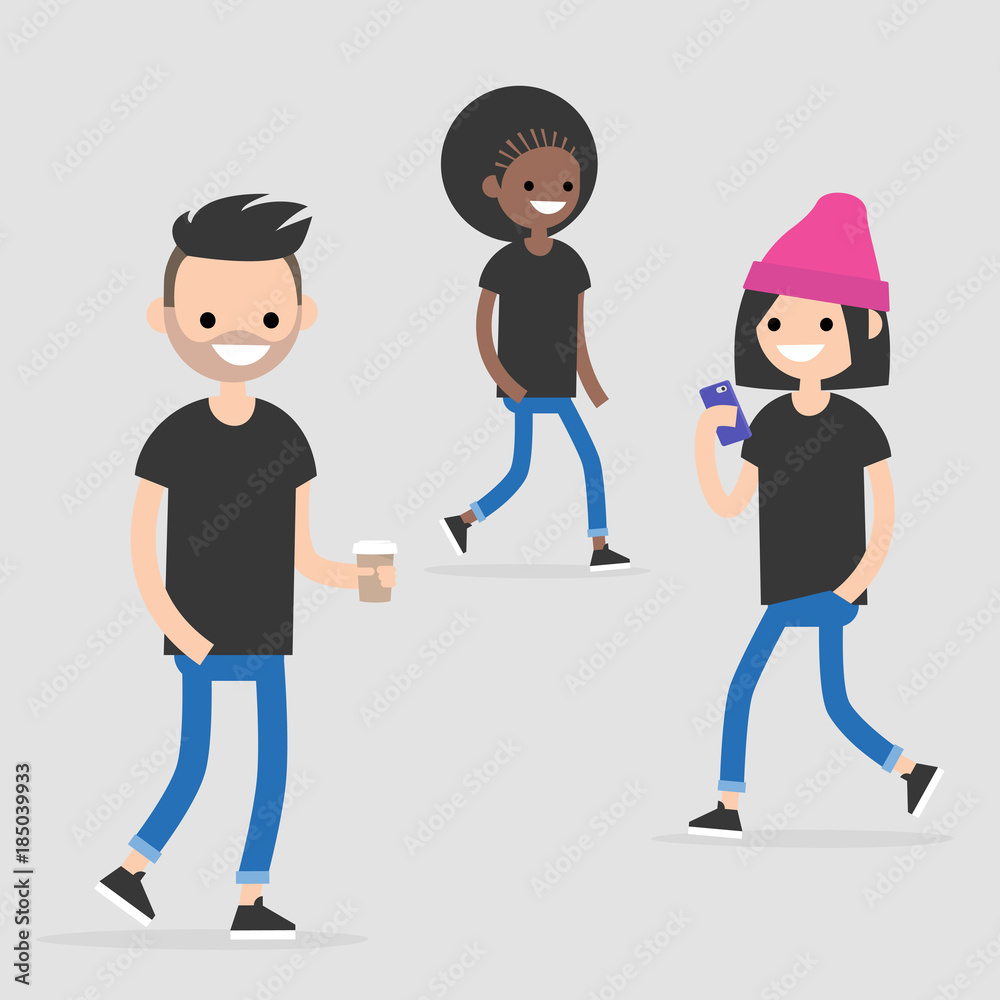 Three diverse young adults walking and smiling-man with coffee, woman with phone, another walking behind-all in casual black tees and jeans.