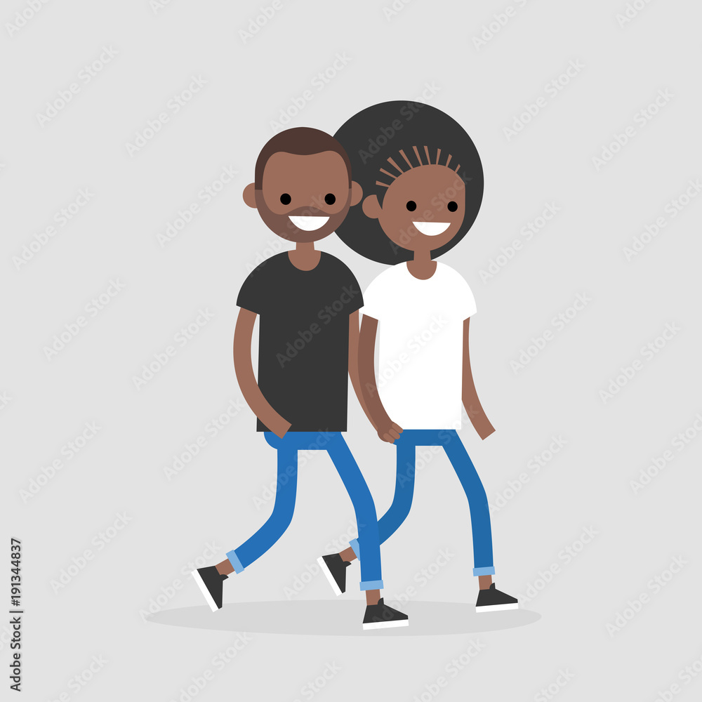 Two smiling Black individuals walking side by side, one in black shirt and blue jeans, the other in white shirt and blue jeans.