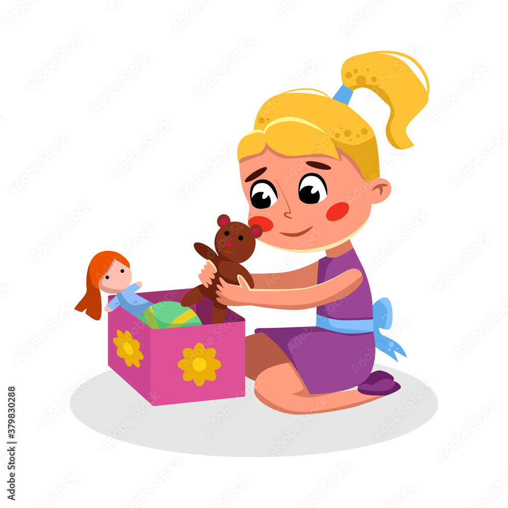 Smiling blonde girl in purple dress playing with teddy bear and doll from a pink flower-decorated toy box.