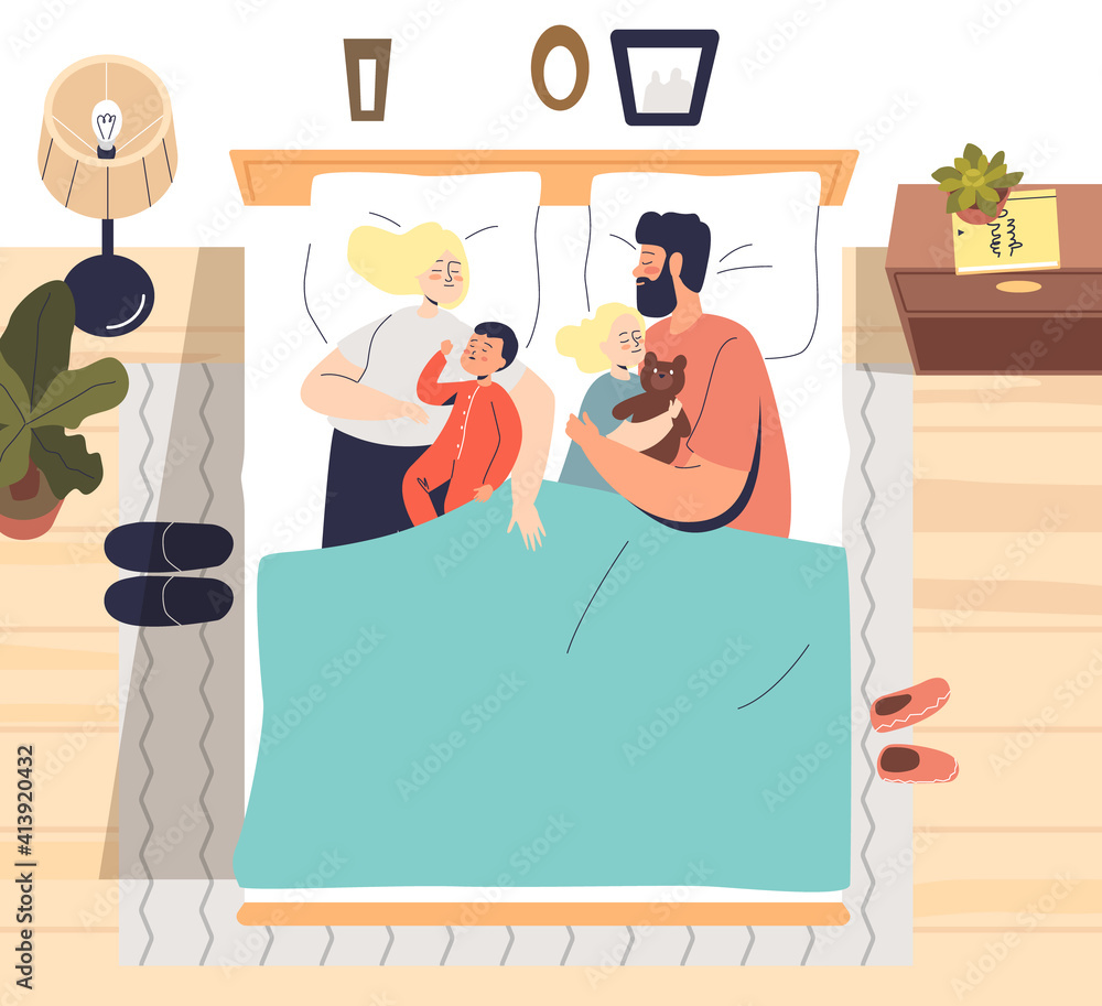 A cozy family of four-parents and two children-snuggling in bed under a teal blanket, with bedside lamps, plants, and framed decor.