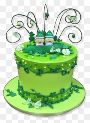 Vibrant green two-tier wedding cake with fondant vines, white flowers, and a couple figurine under wire swirls.