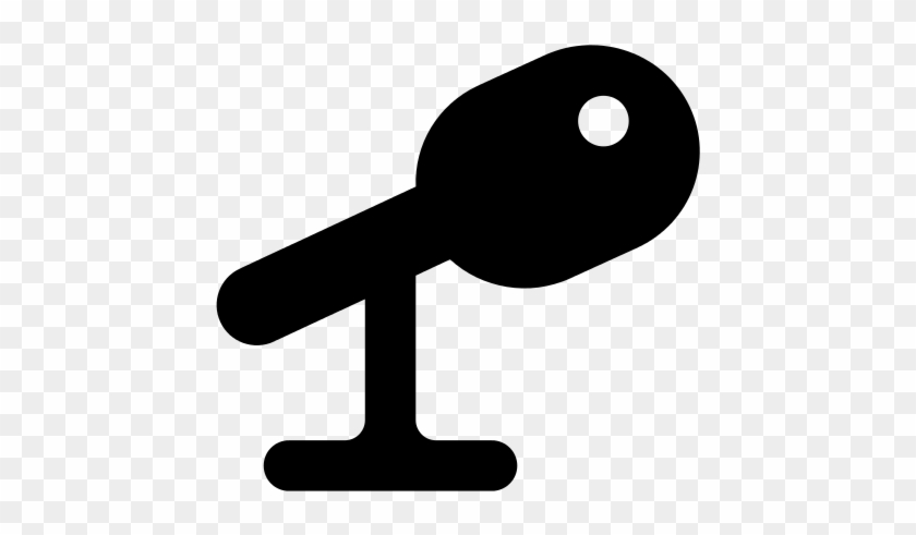 Black silhouette of a key on a stand, symbolizing access, security, or authentication.
