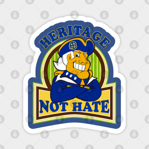 A cartoon mascot in colonial attire with arms crossed, under "HERITAGE NOT HATE" text on a shield-shaped sticker.