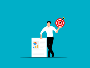 Business professional holding a target with arrow, standing beside data charts on a document.