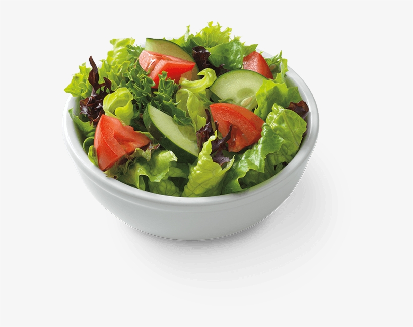 Fresh mixed greens salad with sliced tomatoes and cucumbers in a white bowl.