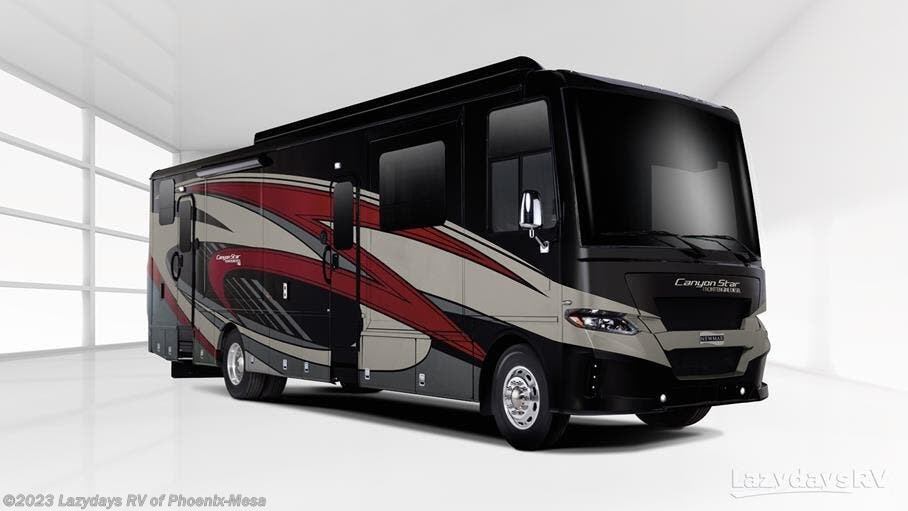 Black and red Canyon Star Class A motorhome with sleek graphics, displayed in a bright studio setting.