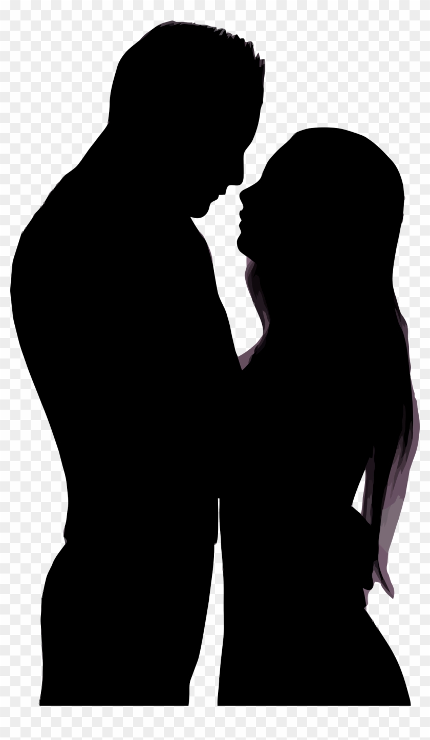 Silhouette of a romantic couple about to kiss, man and woman in intimate profile pose.