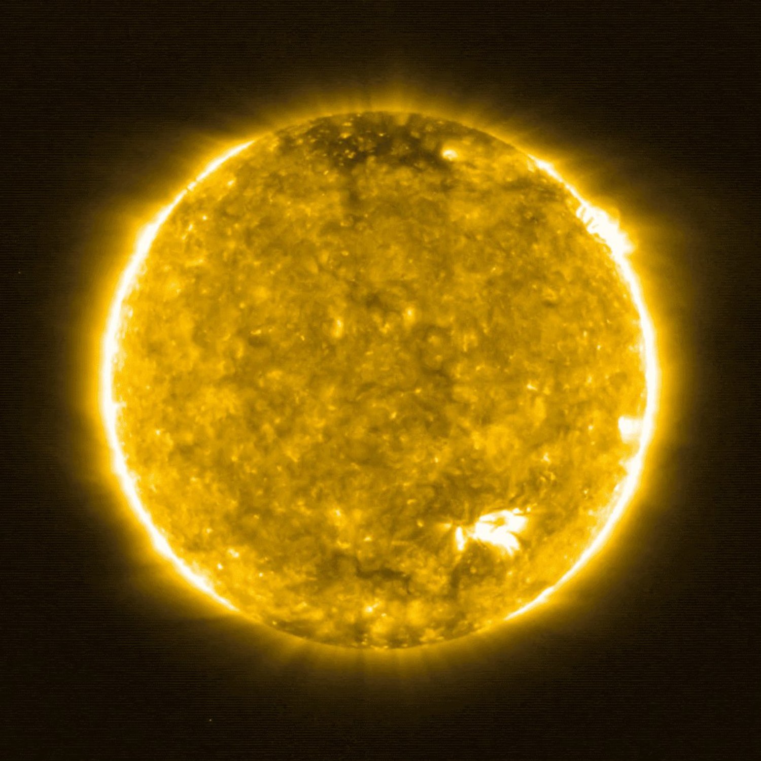 High-resolution image of the Sun showing granular surface texture and bright corona against black space.