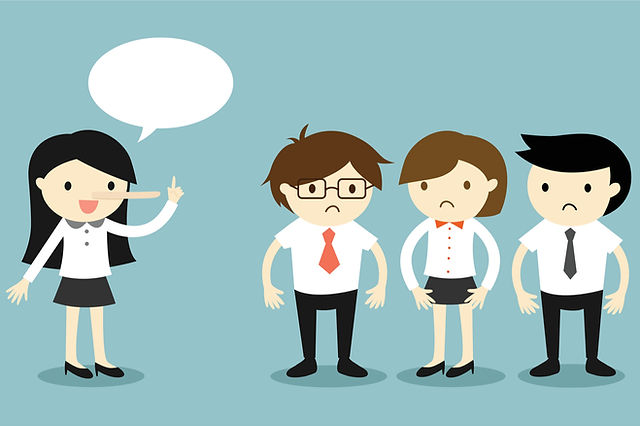 A cartoon businesswoman speaking to three concerned colleagues with empty speech bubble.
