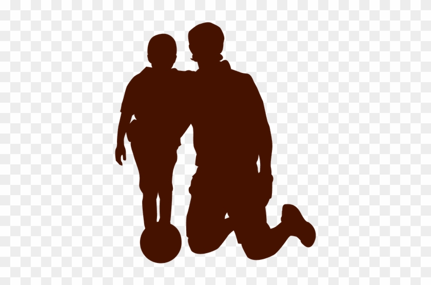 Silhouette of an adult kneeling beside a child with a soccer ball, symbolizing mentorship and youth sports.