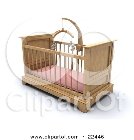 Wooden baby crib with pink mattress and hanging mobile, isolated on white background.