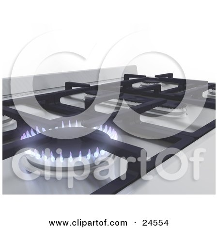 Modern gas stove with blue flames lit on stainless steel cooktop, clean white background.