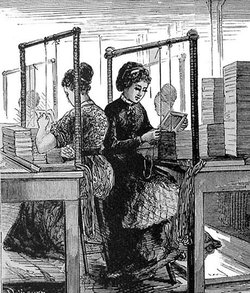 Two women in late 19th-century attire work at bookbinding stations with stacks of books and wooden frames.