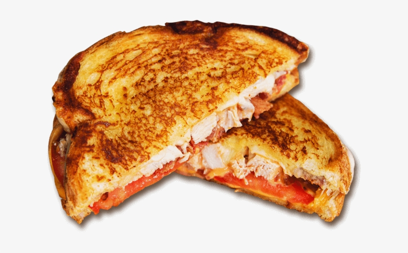 Golden-brown grilled chicken sandwich with melted cheese, tomato, and bacon, cut in half to reveal layers.
