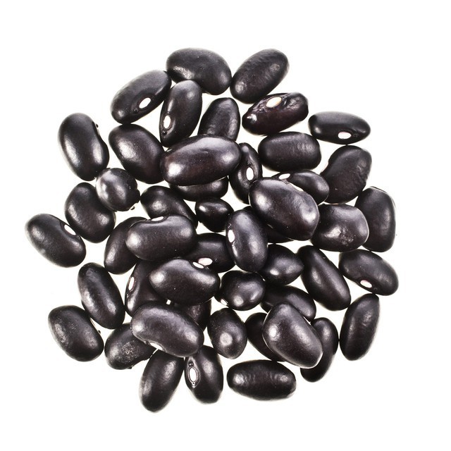 A pile of glossy black beans on a white background, showcasing their smooth texture and oval shape.