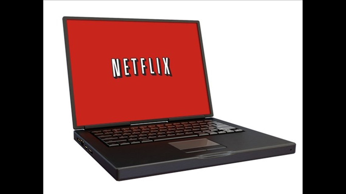 Black laptop displaying Netflix logo on red screen against white background.