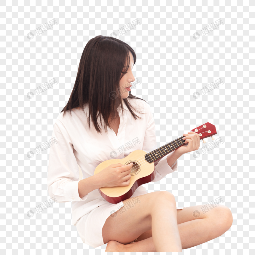 Young woman in white shirt playing a red-headstock ukulele while seated cross-legged.