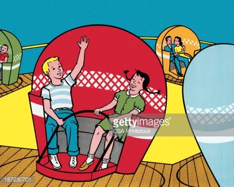 Two children joyfully riding a colorful amusement park ride with waving hands and smiling faces.