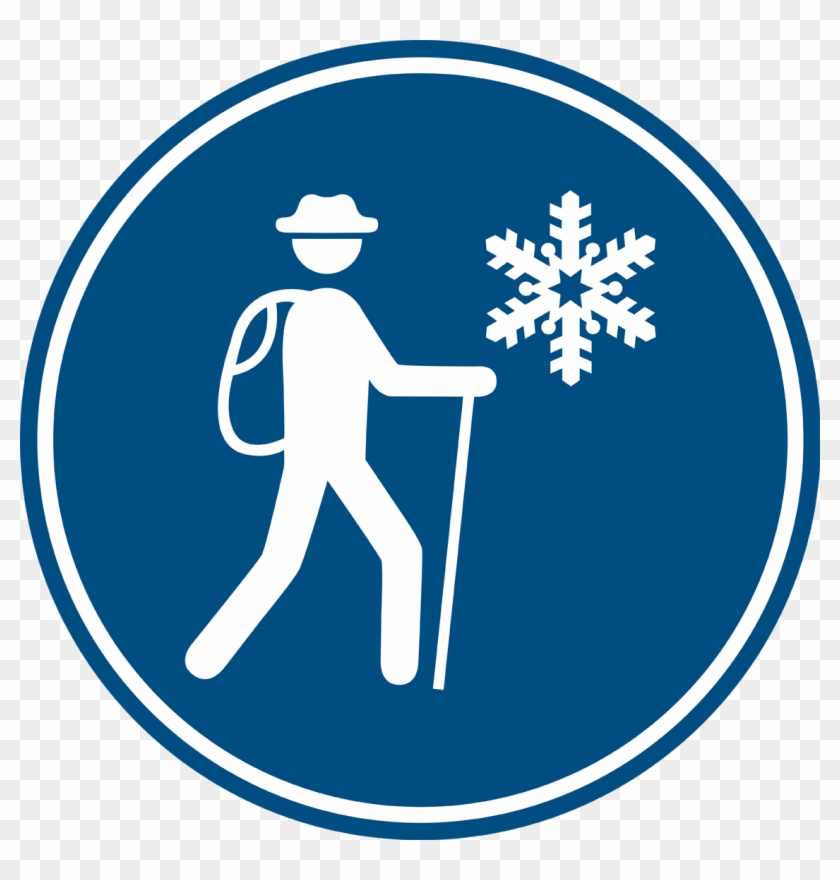 Blue circular sign showing a hiker with backpack and trekking pole beside a snowflake, indicating winter hiking trail.