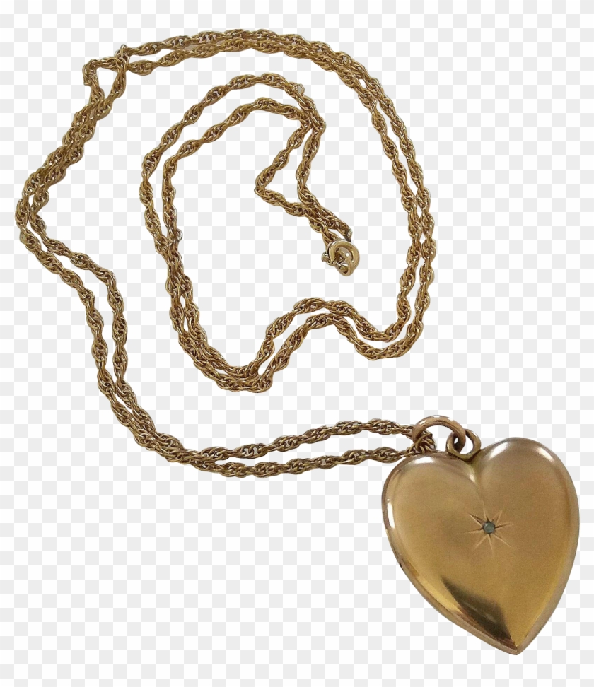 Vintage gold heart-shaped locket pendant on twisted rope chain with small gemstone center.