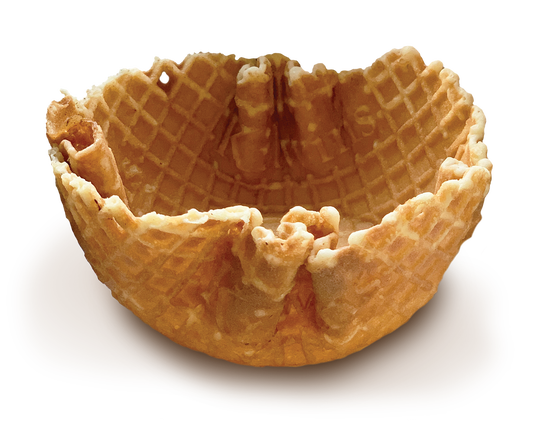 Golden-brown waffle bowl with crisp ridges and scalloped edges, resting on a smooth chocolate sauce base.