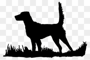 Black silhouette of a standing dog on grass against transparent background