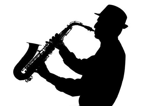 Silhouette of a jazz musician playing saxophone wearing a fedora hat against white background.