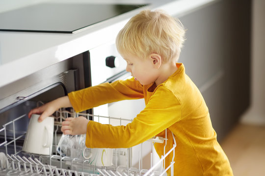 Kid Helping with Chores: Dishwasher Loading Scene