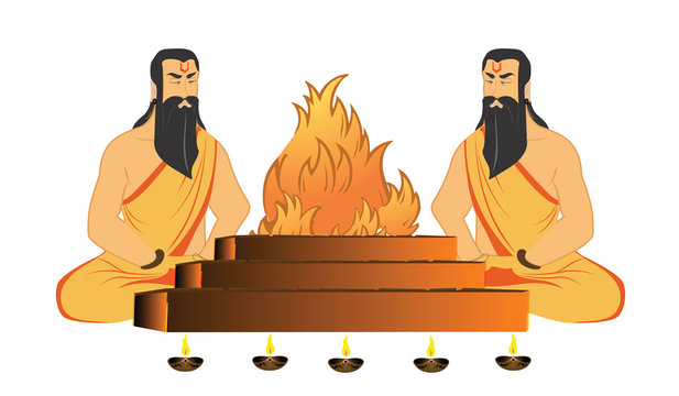 Two Hindu priests performing a yajna ritual with sacred fire and oil lamps.