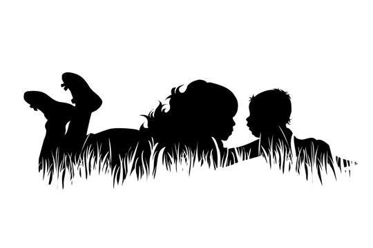Silhouette of two children lying in grass, facing each other, one with feet up-peaceful outdoor moment.