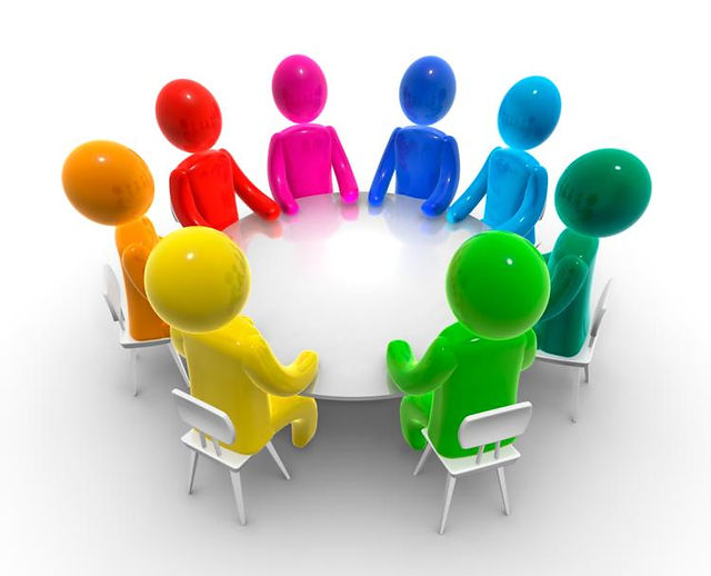 Eight colorful 3D figures seated around a white round table in collaborative discussion.