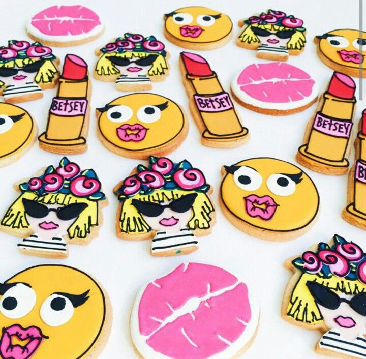 Colorful Betsey Johnson-themed sugar cookies shaped like emojis, lipsticks, and floral sunglasses.