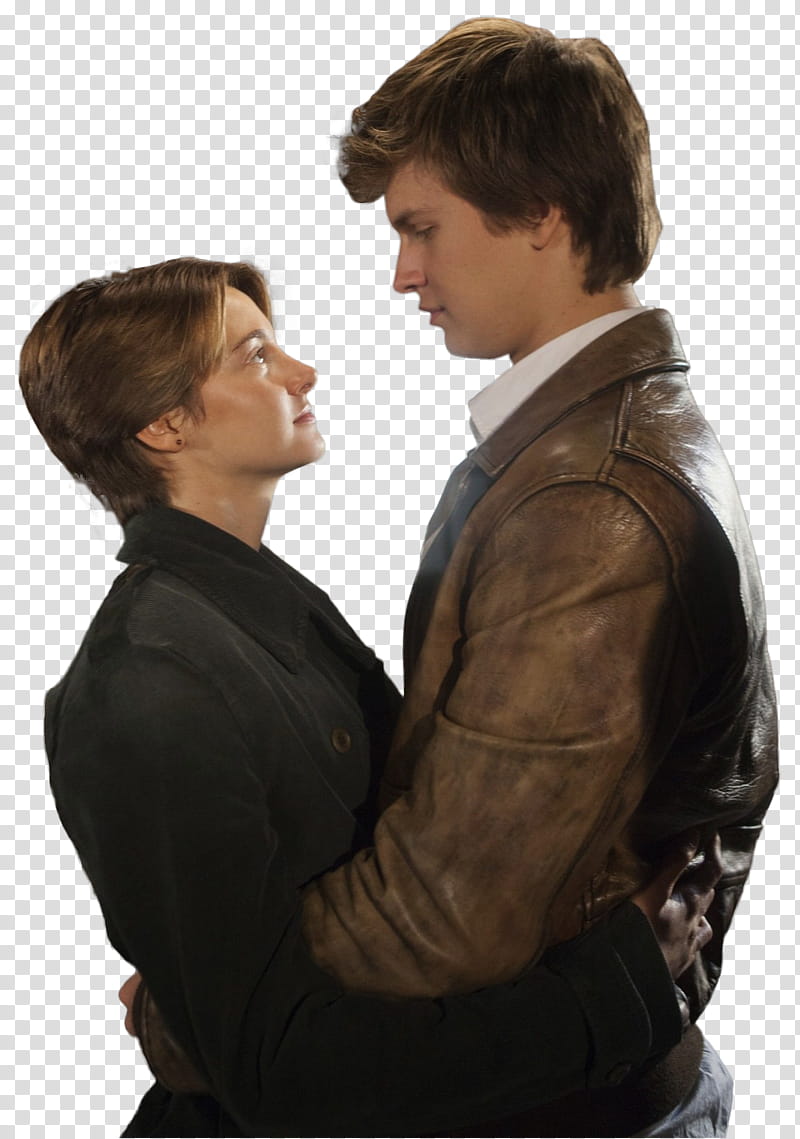 A young man in a brown leather jacket embraces a woman in a black coat as they gaze into each other’s eyes.